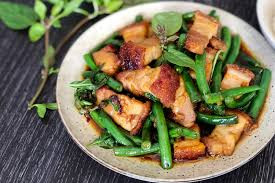 Stir Fried Crispy Pork Belly with hot Basl leaves
